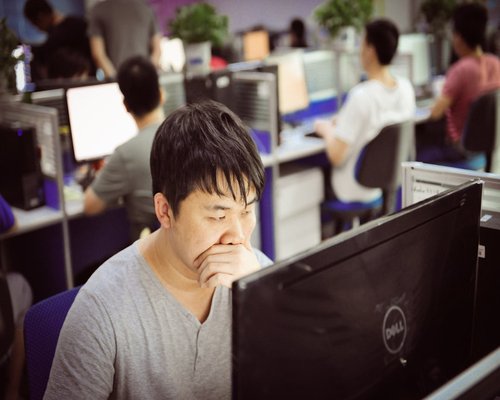 A tired office worker resting eyes from computer screen